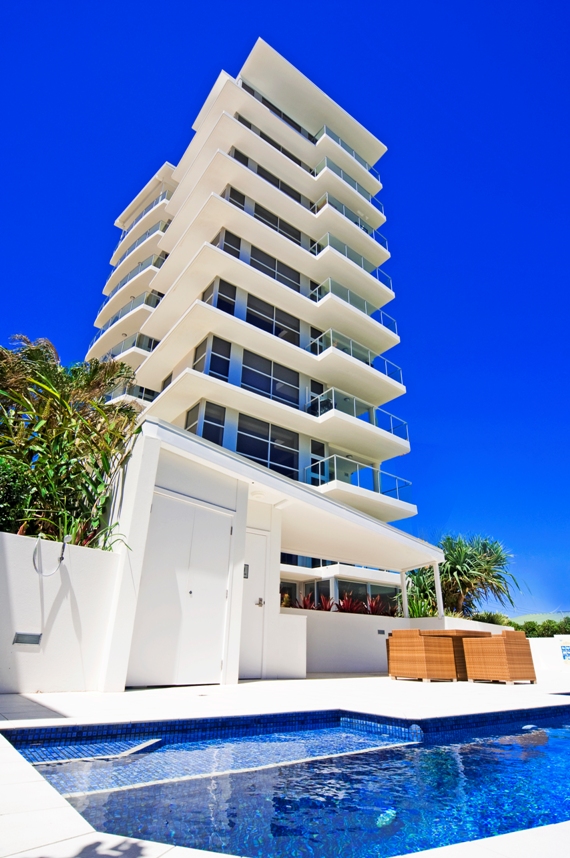 Poolside view of an apartment tower