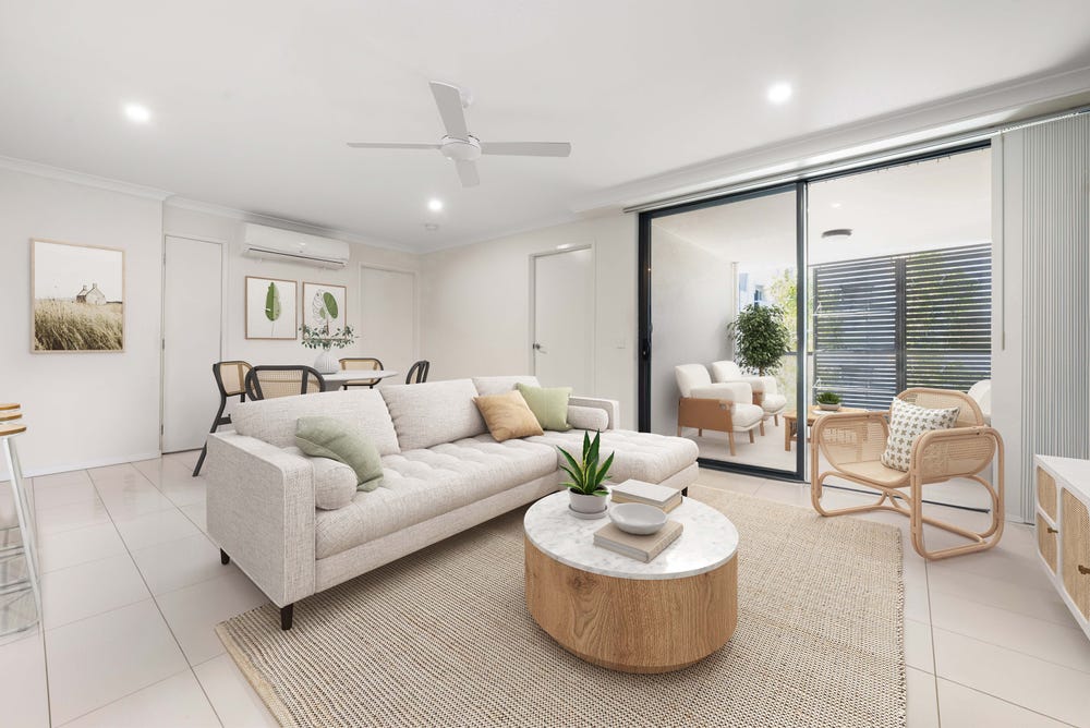 Open-plan living room opening to a balcony